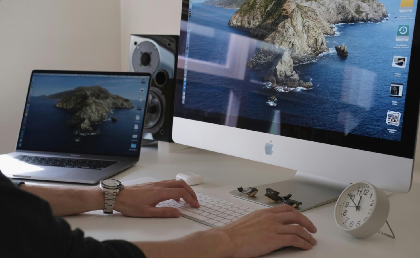 Person reviewing financial documents at desk with calculator and notebook